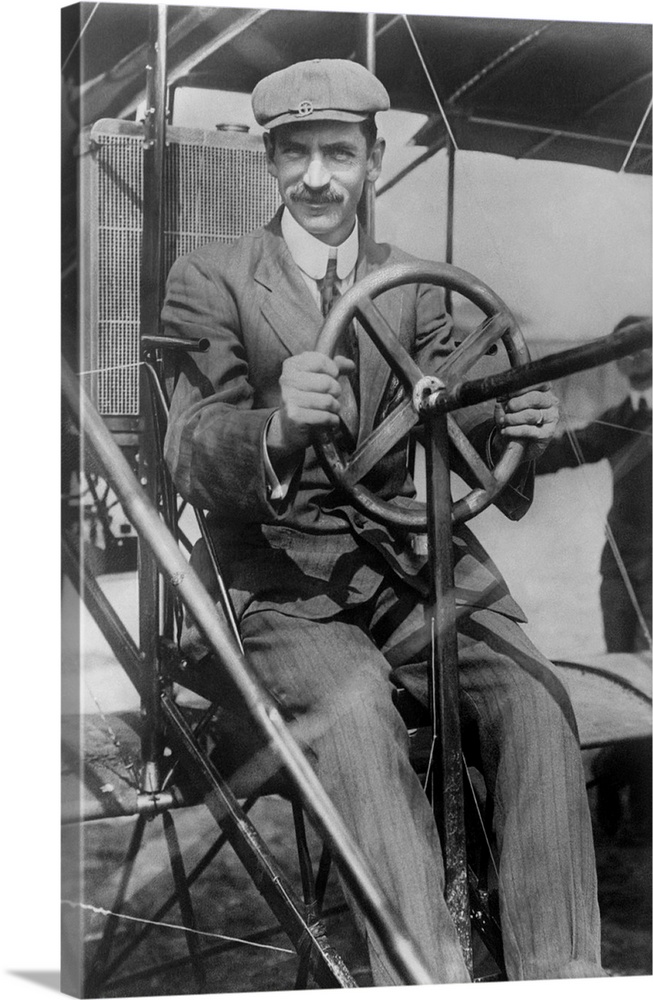 Aviation history photograph of Glenn Curtiss in the pilotos seat of his biplane.
