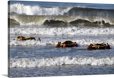 Basic Underwater Demolition/SEAL Students In A Surf Passage Training Exercise