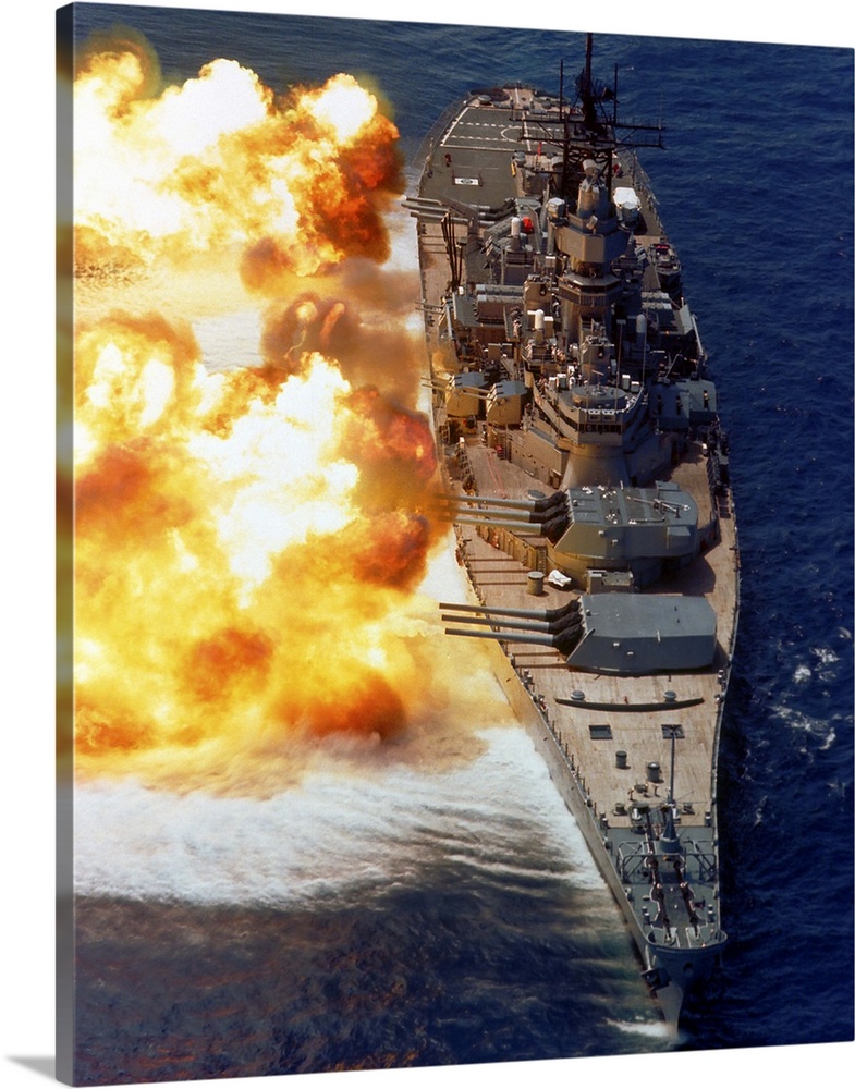 Battleship USS Iowa firing its Mark 7 16-inch/50-caliber guns.