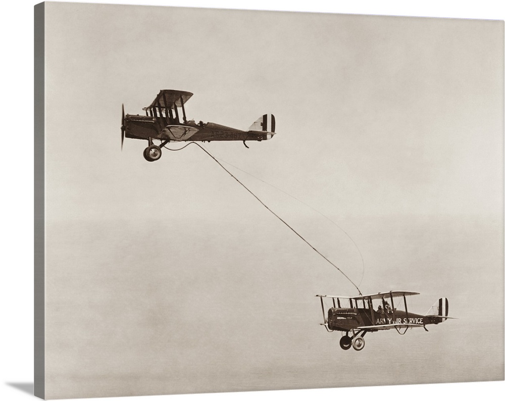 Bi-planes of the United States Army Air Service performing the first public aerial refueling.