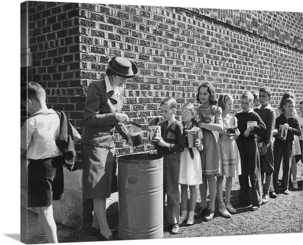 Boys and girls collect fats and greases then turn it over to school authorities, circa 1942