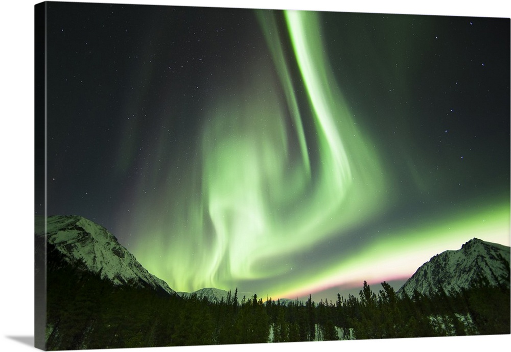 Bright aurora borealis, Annie Lake, Yukon, Canada.