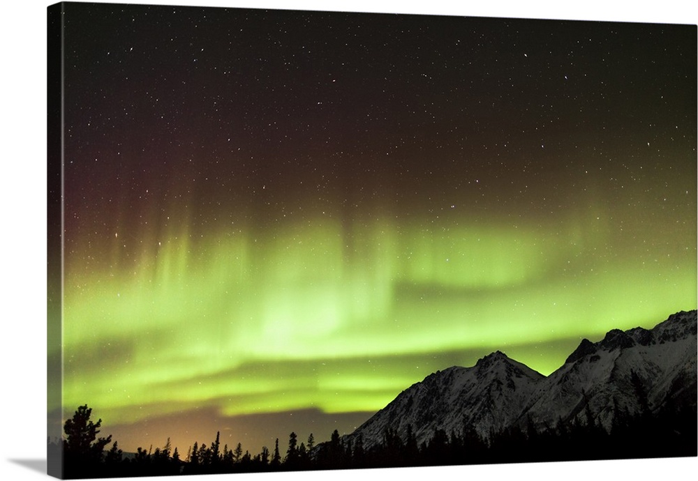 Bright aurora borealis, Annie Lake, Yukon, Canada.