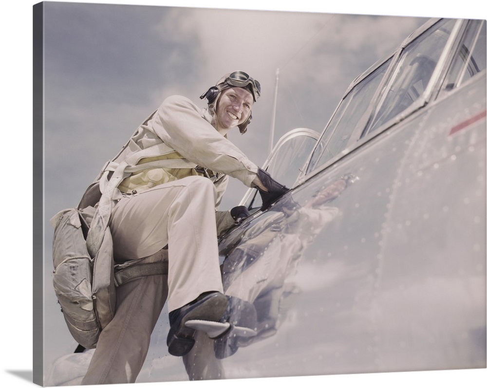 August 1942 - Cadet posing by cockpit of plane at Naval Air Station Corpus Christi, Texas.