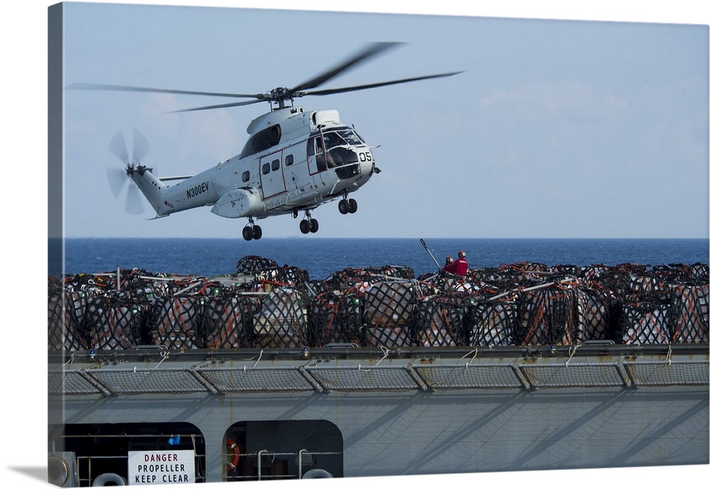 Andaman Sea, January 14, 2015 - An AS-332 Super Puma helicopter attached to dry cargo and ammunition ship USNS Carl Brashe...