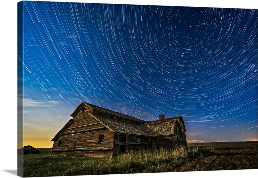 Circumpolar star trails over an old barn in southern Alberta, Canada.