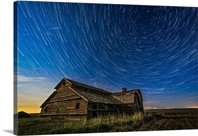 Circumpolar Star Trails Over An Old Barn In Southern Alberta, Canada
