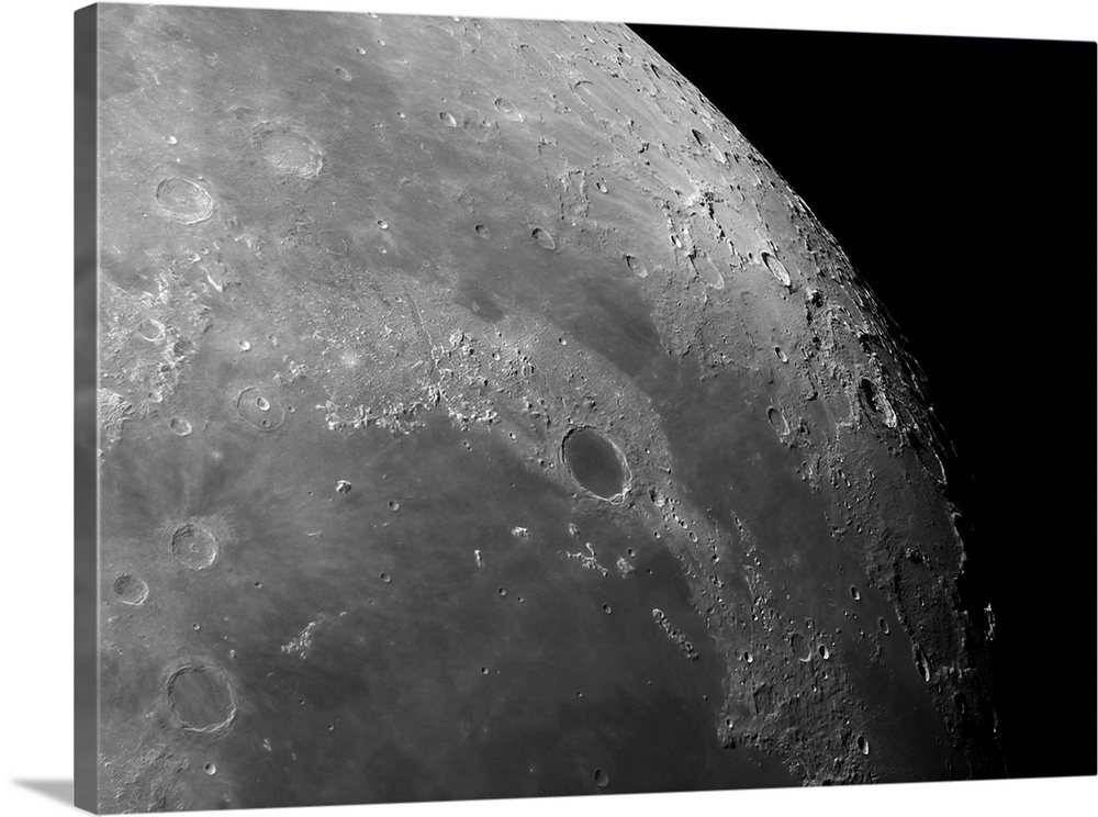 Close-up view of the moon showing impact crater Plato.