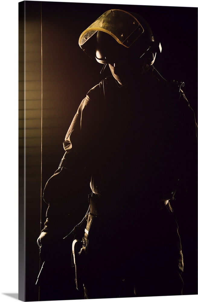 Contour shot of spec ops soldier on black background.