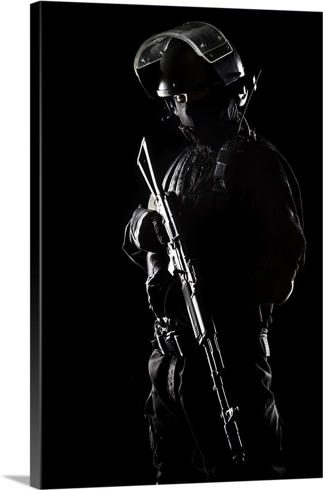 Contour shot of spec ops soldier on black background.