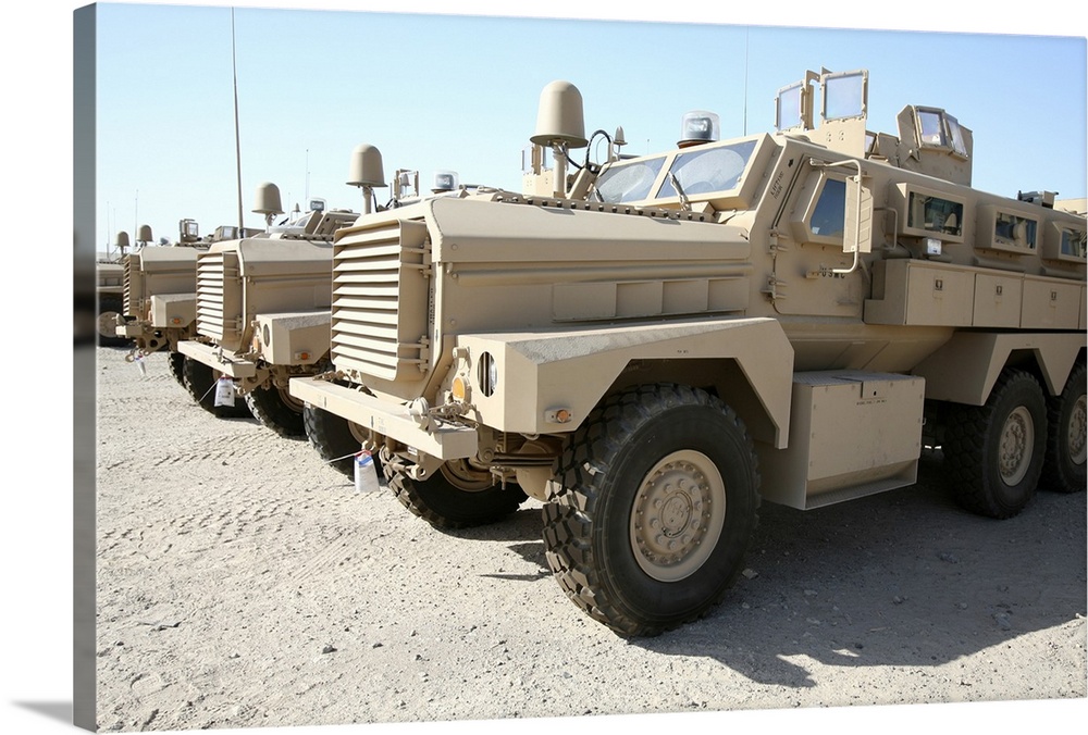 Al Taqaddum, Iraq, September 11, 2007 - Mine Resistant Ambush Protected vehicles await transportation to units throughout ...
