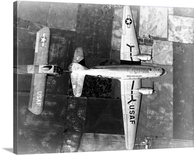 Curtiss C-46E in flight towing a Waco CG-15A glider