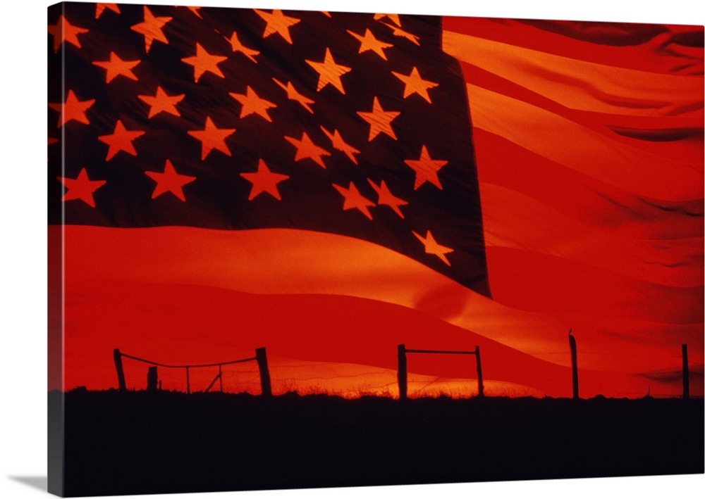 Digital composite of the American Flag over the countryside.