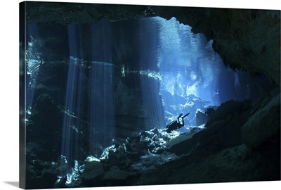 Diver enters the cavern system in the Riviera Maya area of Mexico