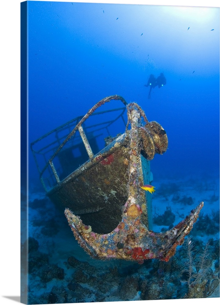 Divers visit the wreck of the Pelicano which sits on the bottom of the Caribbean Sea near Playa Del Carmen, Mexico.