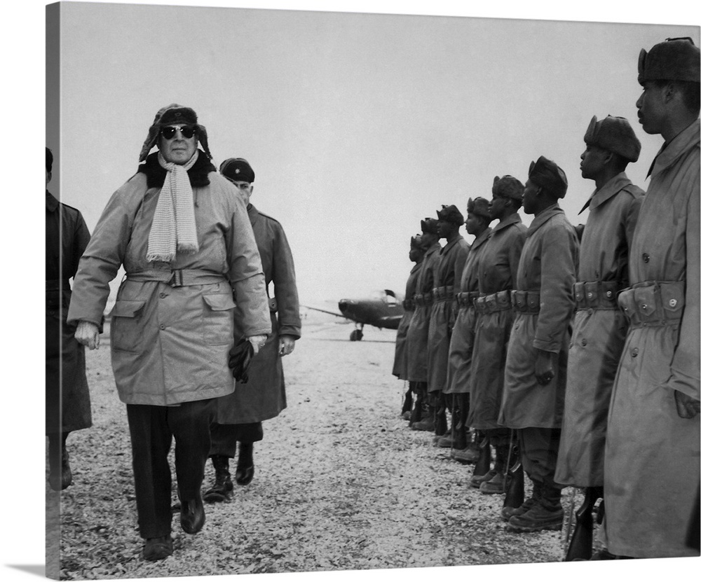 General Douglas MacArthur inspecting troops of the 24th Infantry Division upon arrival at the Kimpo Airfield.