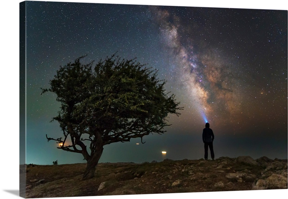 Explorer looking at the Milky Way from the coast of the Black Sea.