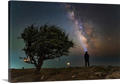 Explorer looking at the Milky Way from the coast of the Black Sea