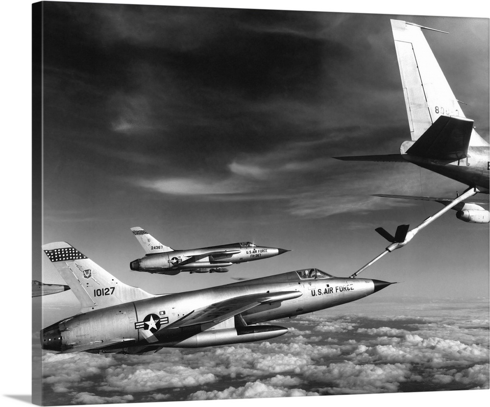 F-105 Thunderchief planes pull up to a KC-135 Stratotanker refueling aircraft, 1966.