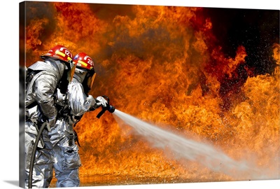 Firefighters combat a JP-8 jet fuel fire