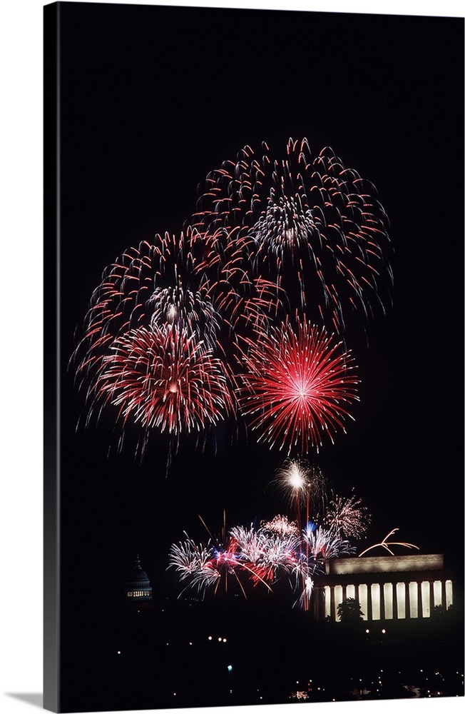Fireworks light up the night sky above the Lincoln Memorial.