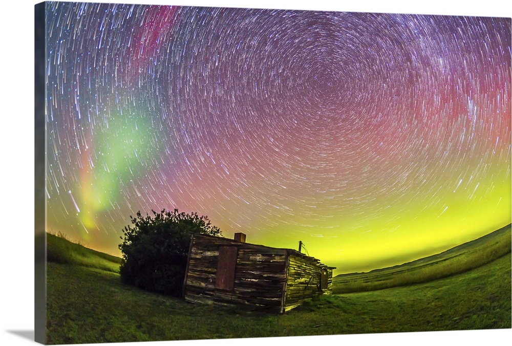 August 27-28, 2014 - Fish-eye lens composite of aurora borealis and circumpolar star trails above the old Larson Ranch sit...