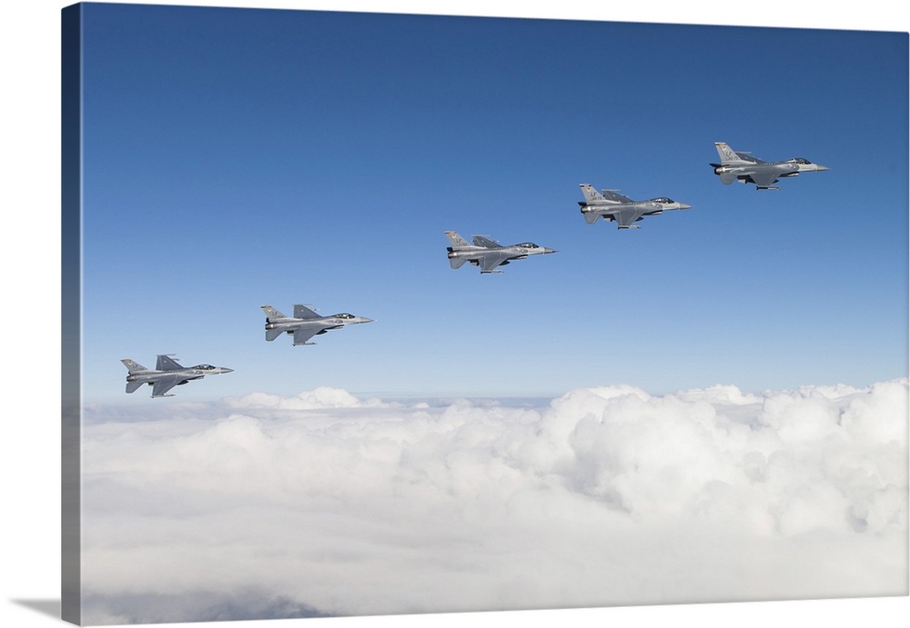 Five F-16Cs of the U.S. Air Force 310th Fighter Squadron fly in formation.