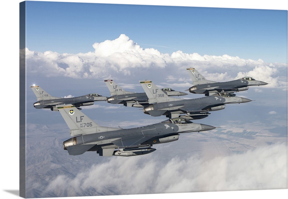 Five F-16Cs of the U.S. Air Force 310th Fighter Squadron fly in formation.