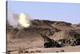 image thumbnail of Flame and smoke emerge from the muzzle of an M198 Howitzer