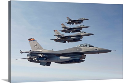 Four F-16s fly in formation over Arizona