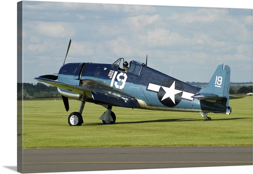 Grumman F6F Hellcat in World War II U.S. Navy colors while taxiing at Duxford airport, England.