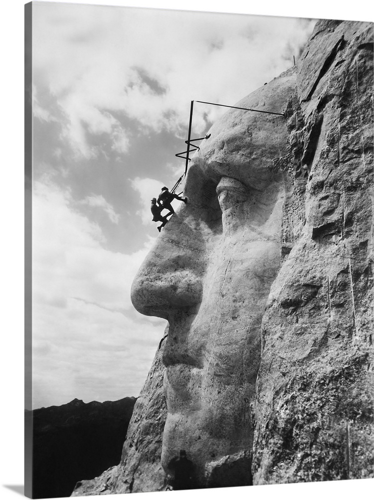 Gutzon Borglum inspecting work on the face of President Washington, Mt. Rushmore, South Dakota.