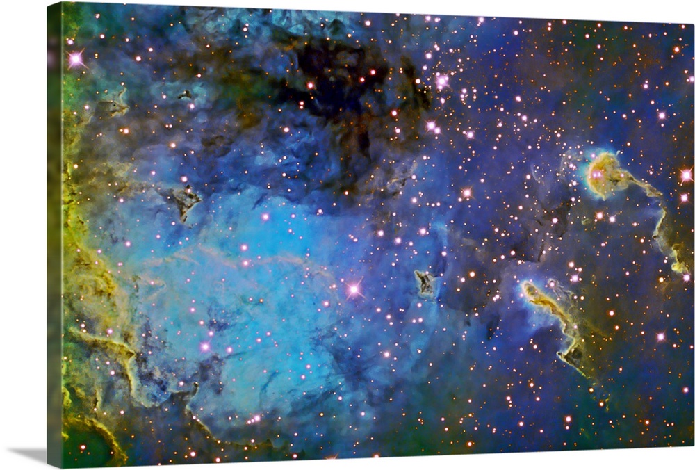 Photograph of galaxy filled with color gas formations and brightly colored stars.