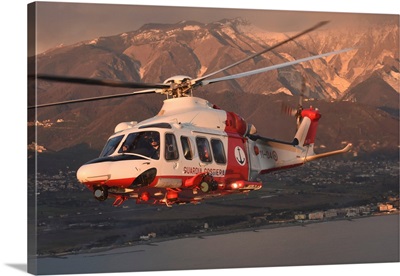 Italian Coast Guard PH-139B Helicopter Taken In Flight At Sunset