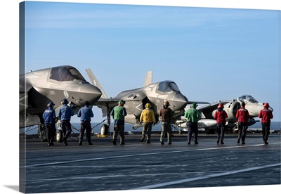 Italian Navy Personnel On The Deck Of The ITS Cavour Aircraft Carrier