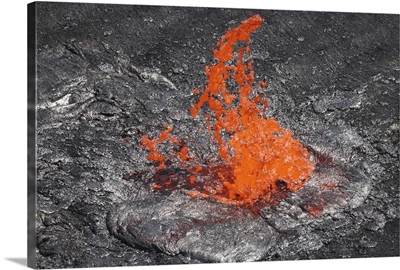 Lava bubble bursting through crust of active lava lake