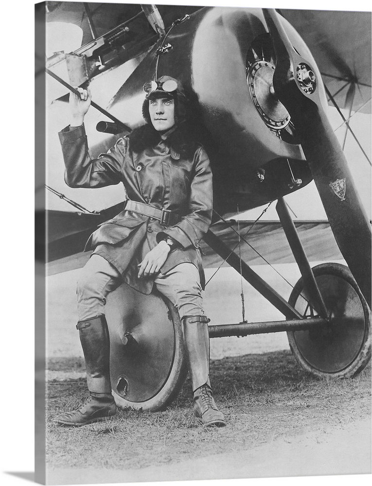 Lieutenant Earl Carroll seated on the wheel of his fast scout airplane, 1918.