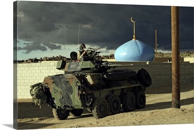 Light armored vehicle commander mans the M240G machine gun