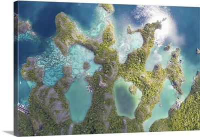 Limestone Islands Rise Around A Beautiful Lagoon Seascape In Raja Ampat, Indonesia