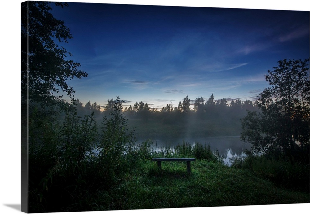 Lonely bench on the bank of the Sestra River in Russia.