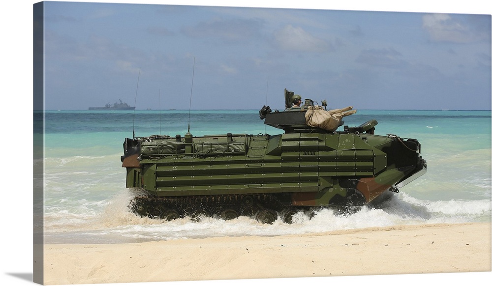 Marines drive an Amphibious Assault Vehicle on the beach of Hawaii.