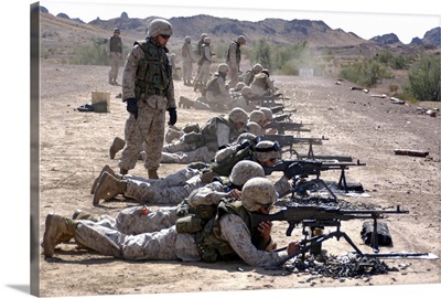Marines fire their M240G medium machine guns and M249 squad automatic weapons