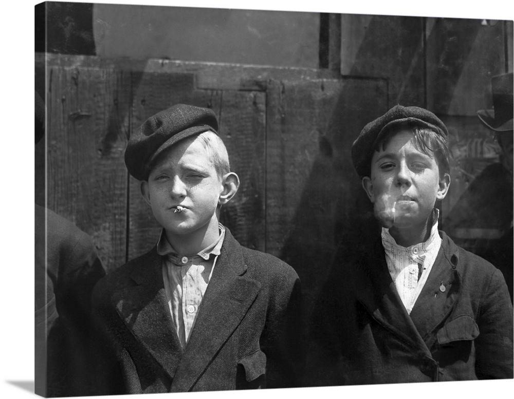 May 9, 1910 - Young newsboys smoking on a St. Louis, Missouri street.