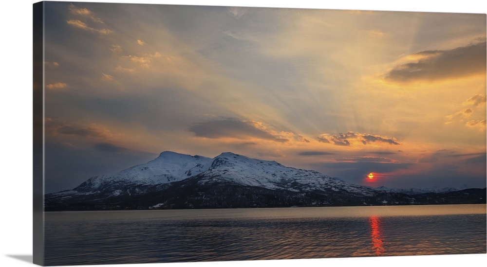 Midnight Sun over Tjeldsundet and the Saetertinden Mountain in Troms County, Norway.