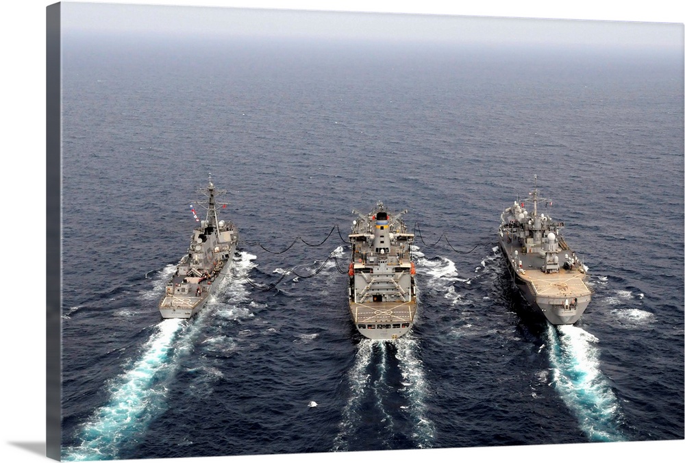February 17, 2011 -  USS Mustin (DDG-89), left, USNS Tippecanoe (T-AO 199), and 7th Fleet command ship USS Blue Ridge (LCC...