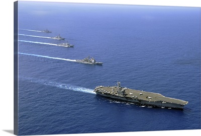 Military ships operate in formation in the South China Sea