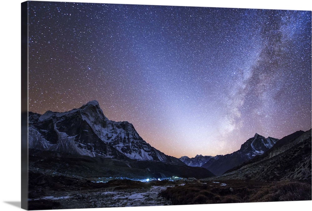 Milky way vs. zodiacal light, a celestial V was captured after sunset over the Himalayas in eastern Nepal. The Sherpa's mo...