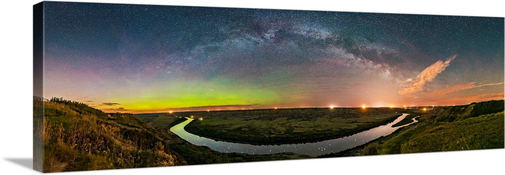 Milky Way arching over the scenic bend of the Red Deer River, Alberta, Canada.