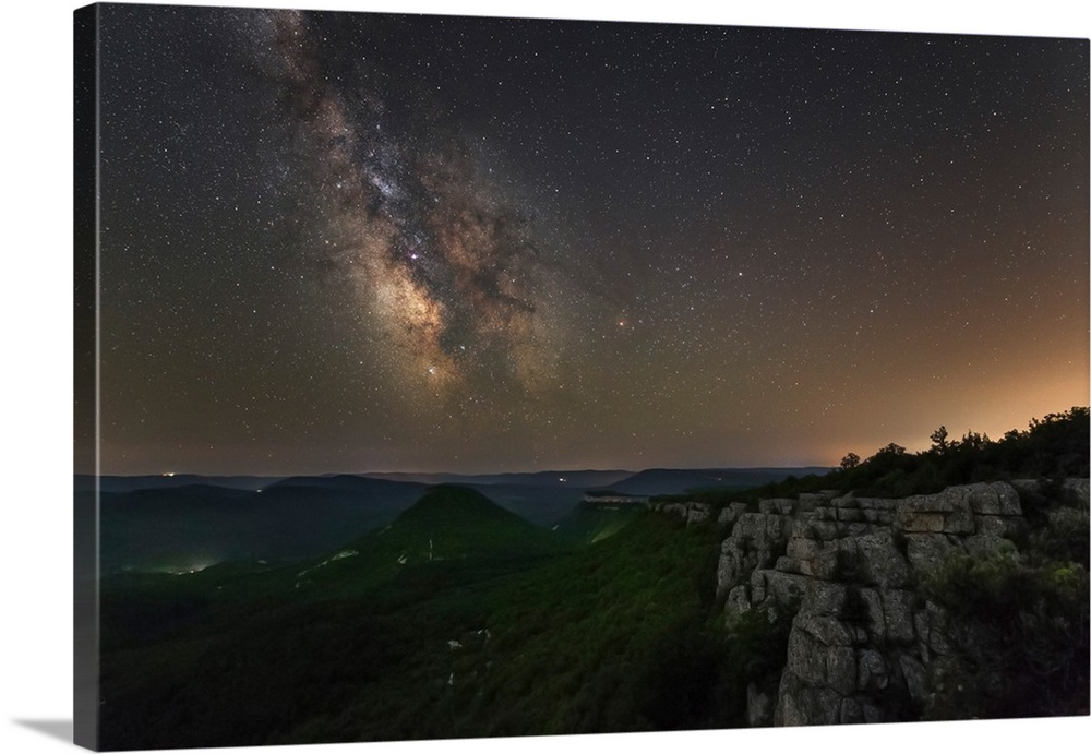 Milky Way over the forest covered mountains in Crimea.
