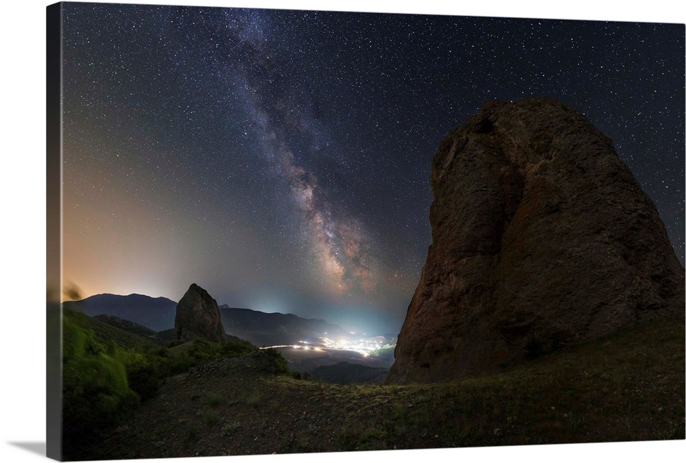 Milky Way over the shining town of Veseloe in Russia.